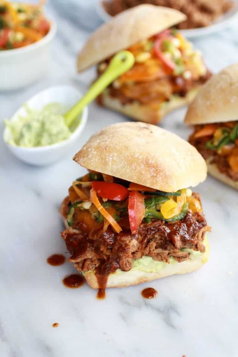 Cheesy Crockpot Cajun Pulled Pork with Southwest Pepper-Corn Slaw | halfbakedharvest.com