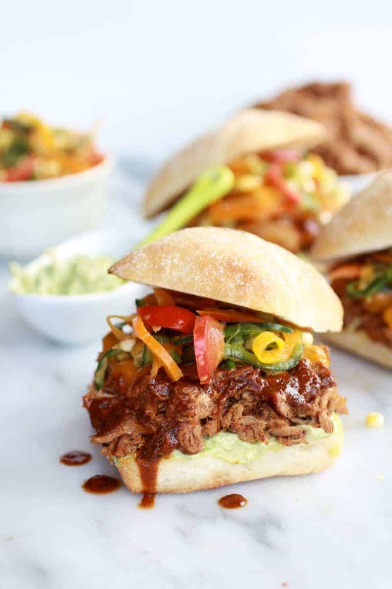 Cheesy Crockpot Cajun Pulled Pork with Southwest Pepper-Corn Slaw | halfbakedharvest.com