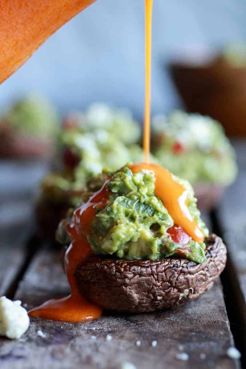 Blue Cheese Guacamole Stuffed Mushrooms with Buffalo Sauce | halfbakedharvest.com