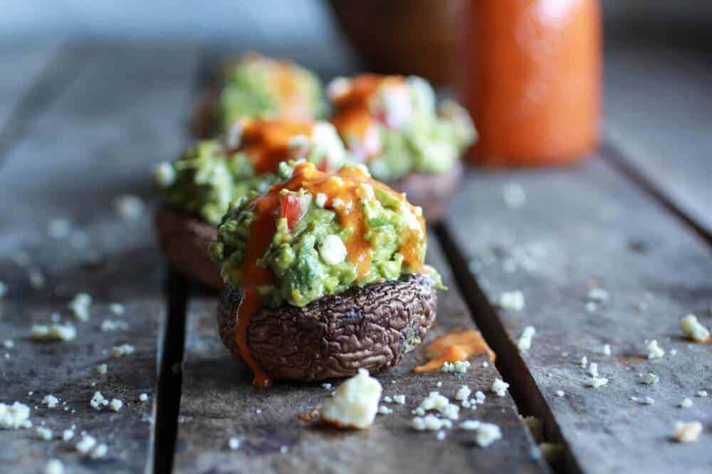 Blue Cheese Guacamole Stuffed Mushrooms with Buffalo Sauce | halfbakedharvest.com