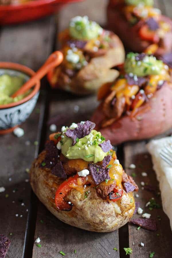 Steak Fajita Stuffed Baked Potatoes with Avocado Chipotle Crema | halfbakedharvest.com