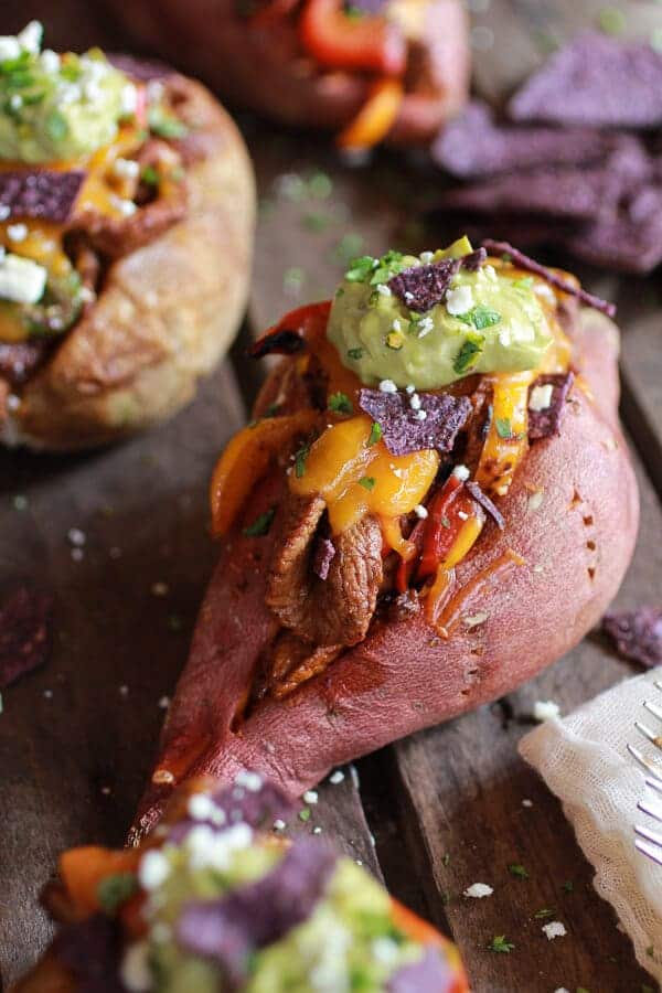 Steak Fajita Stuffed Baked Potatoes with Avocado Chipotle Crema | halfbakedharvest.com