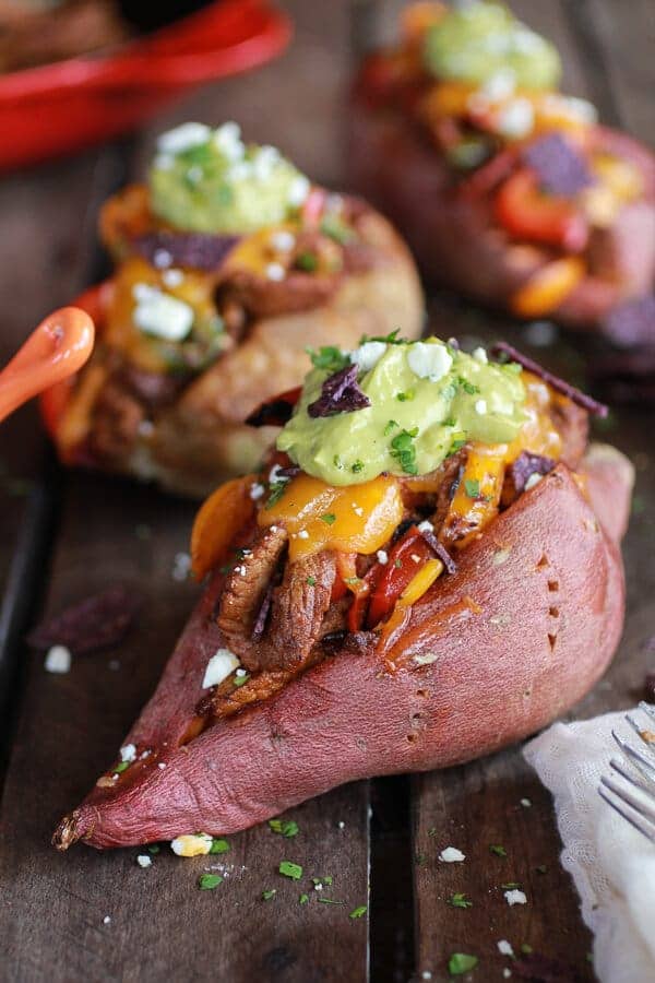 Steak Fajita Stuffed Baked Potatoes with Avocado Chipotle Crema | halfbakedharvest.com