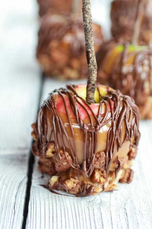 Sweet and Salty Bourbon Cinnamon Pecan Caramel Apples + Chocolate Drizzle | halfbakedharvest.com