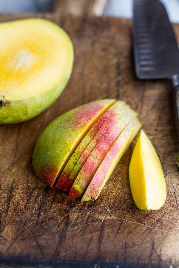 Coconut Banana Oats Smoothie Bowl with Crunchy Black Sesame Quinoa Cereal + Mango | halfbakedharvest.com