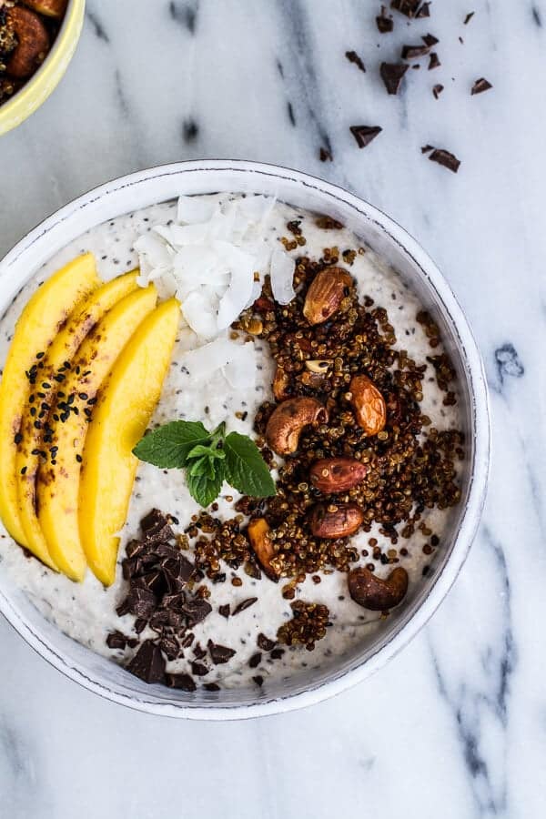 Coconut Banana Oats Smoothie Bowl with Crunchy Black Sesame Quinoa Cereal + Mango | halfbakedharvest.com