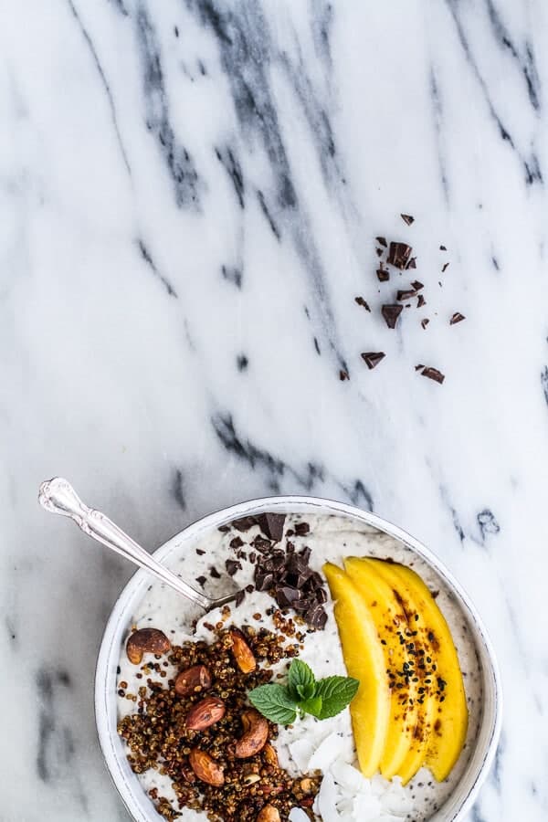 Coconut Banana Oats Smoothie Bowl with Crunchy Black Sesame Quinoa Cereal + Mango | halfbakedharvest.com