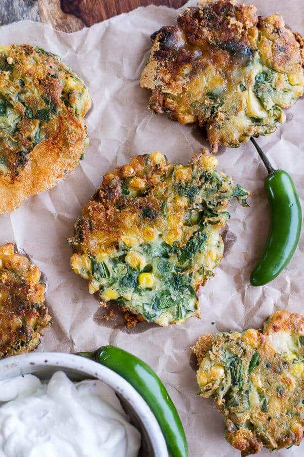 Spinach and Artichoke Corn Fritters with Brie and Sweet Honey Jalapeño Cream | halfbakedharvest.com