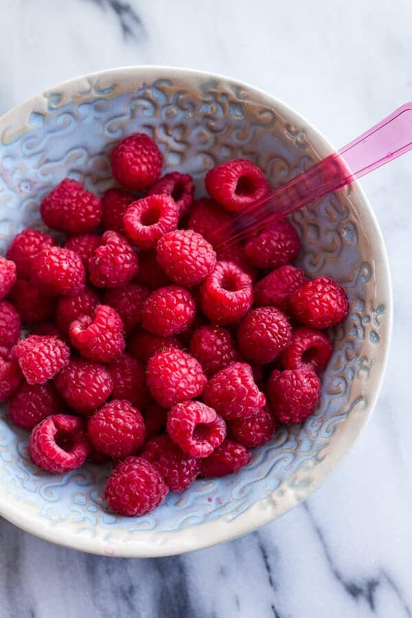 Vanilla Bean Coconut Quinoa Pudding with Honey Drizzled Raspberries | halfbakedharvest.com