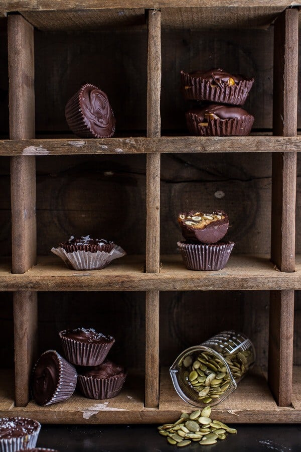Mini Chocolate Pumpkin Seed Candy Peanut Butter Cups | halfbakedharvest.com @hbharvest