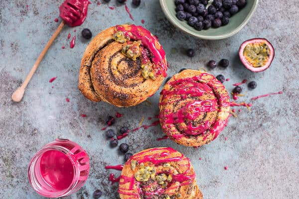 Meyer Lemon Poppy Seed Morning Buns with Blueberry Passionfruit Glaze | halfbakedharvest.com @hbharvest