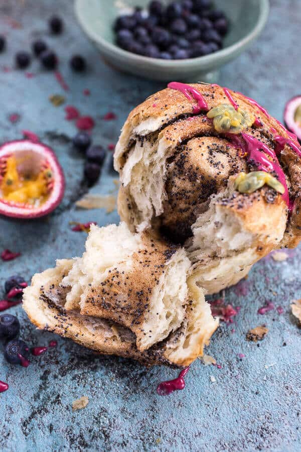 Meyer Lemon Poppy Seed Morning Buns with Blueberry Passionfruit Glaze | halfbakedharvest.com @hbharvest