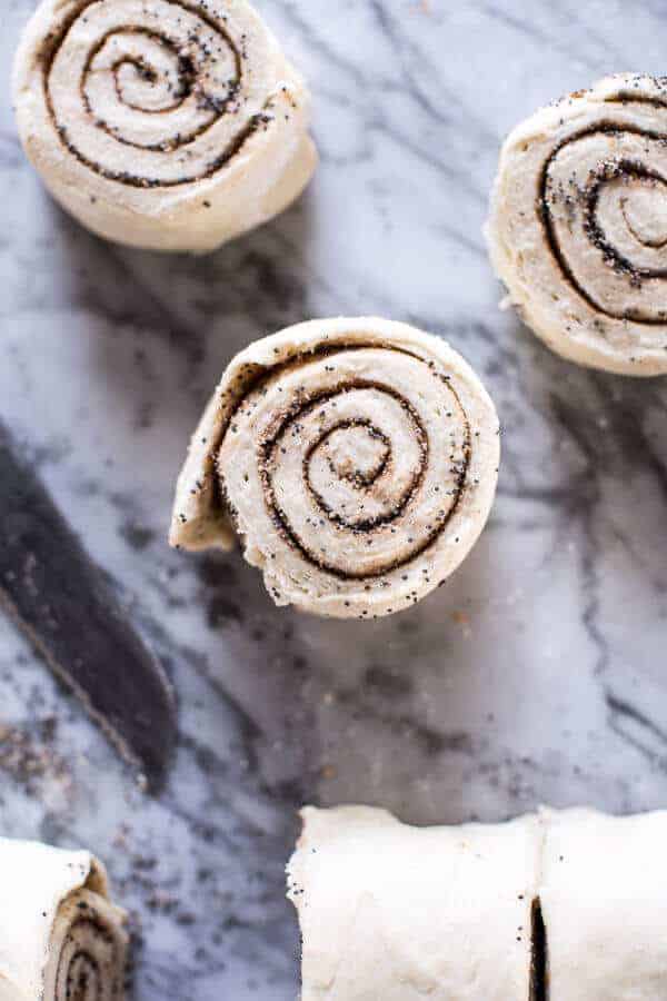 Meyer Lemon Poppy Seed Morning Buns with Blueberry Passionfruit Glaze | halfbakedharvest.com @hbharvest