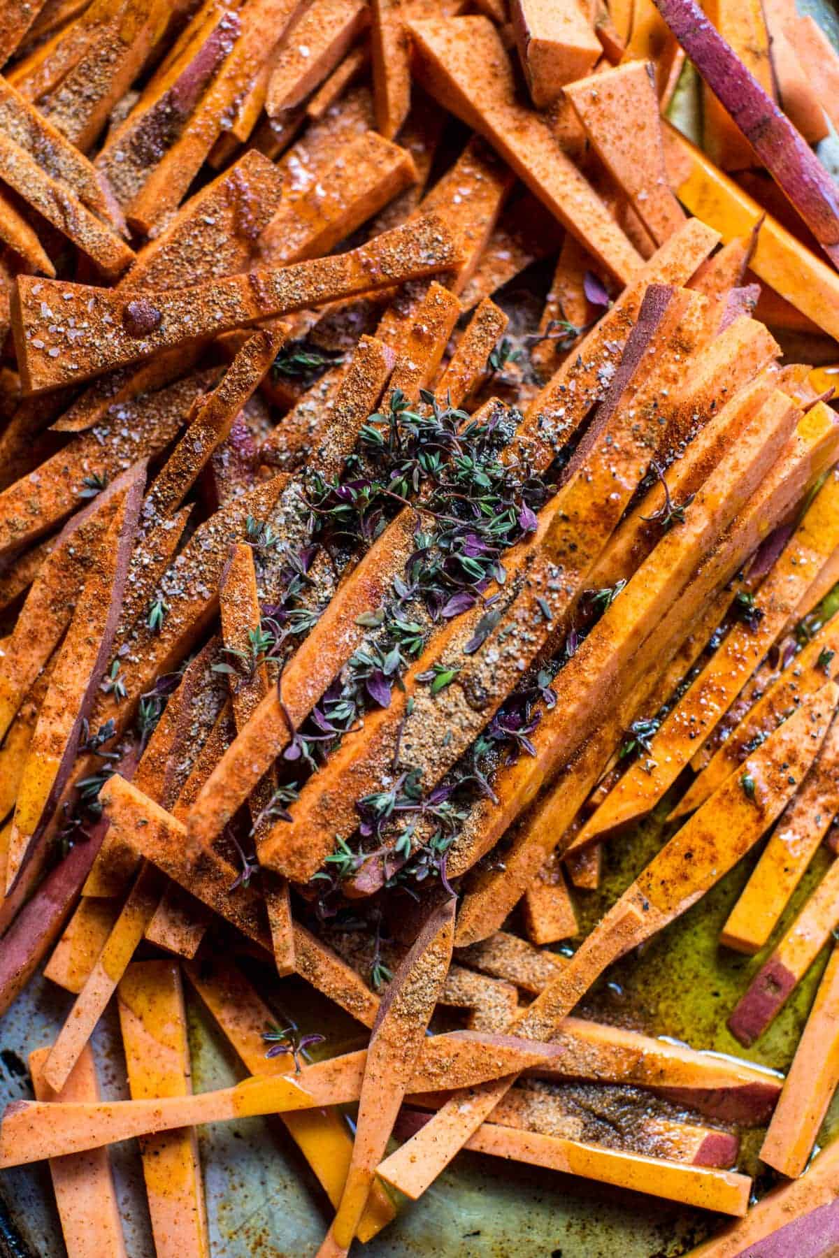 Skinny Cajun Sweet Potato Fries with Garlic Cheese Sauce | halfbakedharvest.com @hbharvest