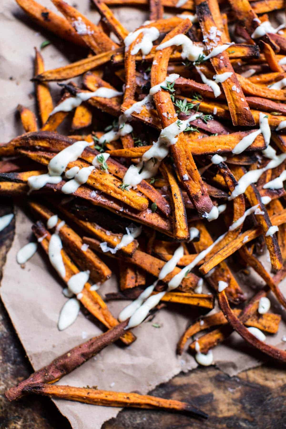 Skinny Cajun Sweet Potato Fries with Garlic Cheese Sauce | halfbakedharvest.com @hbharvest