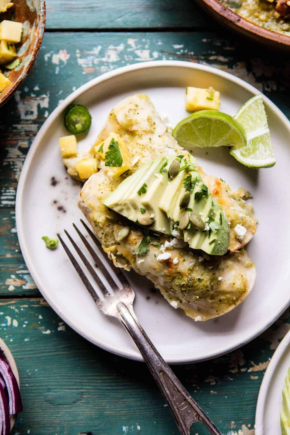 Lightened Up Salsa Verde Chicken Enchiladas with Pineapple Avocado Salsa | halfbakedharvest.com @hbharvest