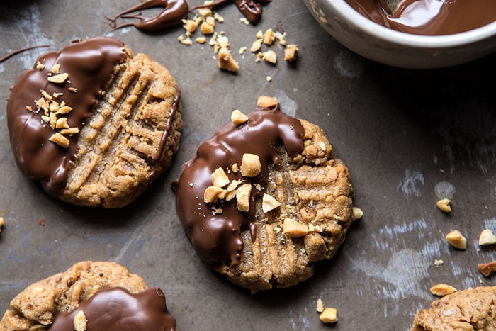 5 Ingredient Chocolate Dipped Peanut Butter Cookies | halfbakedharvest.com #healthy #cookies #dates #glutenfree