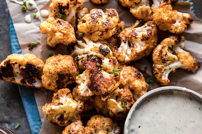 Spicy Cauliflower Cheese Bites with Tahini Ranch | halfbakedharvest.com #cauliflower #healthy #recipe