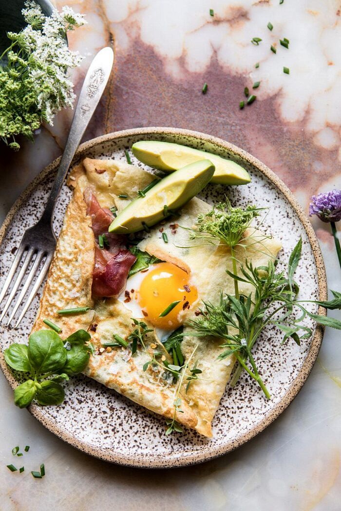 Baked Egg Crepes with Spring Herbs and Avocado | halfbakedharvest.com #breakfast #brunch #easyrecipe close up overhead photo of Baked Egg Crepes with Spring Herbs and Avocado
