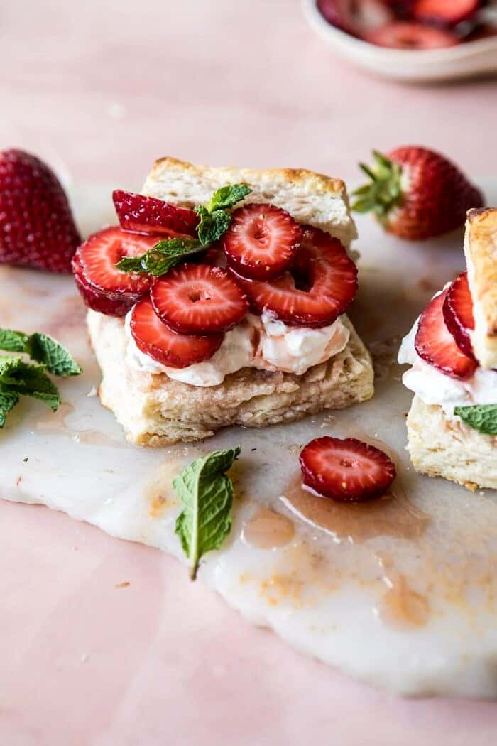 Strawberry Bourbon Shortcakes | halfbakedharvest.com #strawberries #shortcake #spring #summer #easyrecipe angled photo of Strawberry Bourbon Shortcakes