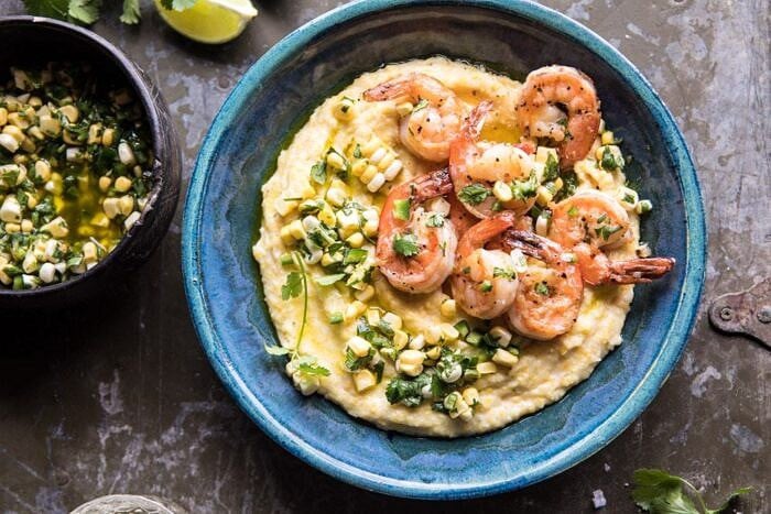 overhead horizontal photo of Sweet Corn Chimichurri Butter Shrimp with Polenta 