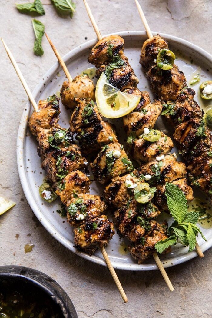 side angle overhead photo of Moroccan Grilled Chicken with Herby Lemon Olive Vinaigrette 