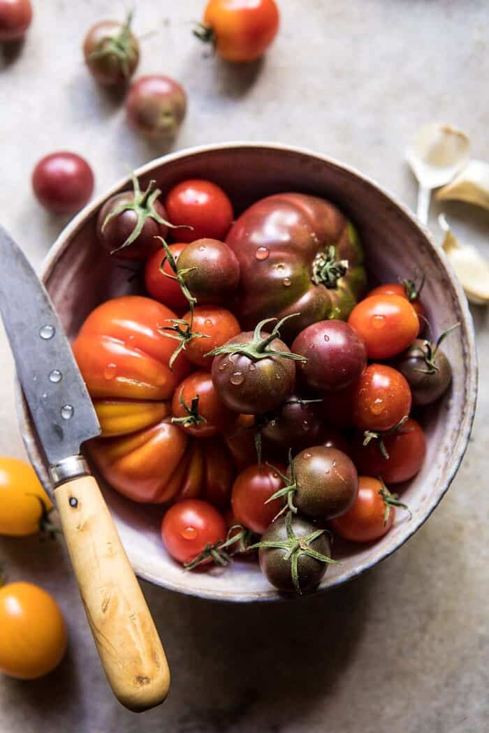 Heirloom Tomato, Basil, and Manchego Toast | halfbakedharvest.com #tomatoes #basil #easyrecipes #summerrecipes overhead photo of raw tomatoes