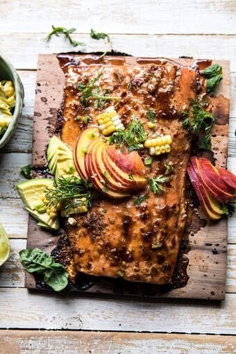 Honey Ginger Cedar Plank Grilled Salmon with Avocado Salsa | halfbakedharvest.com #salmon #summerrecipes #healthyrecipes #easy