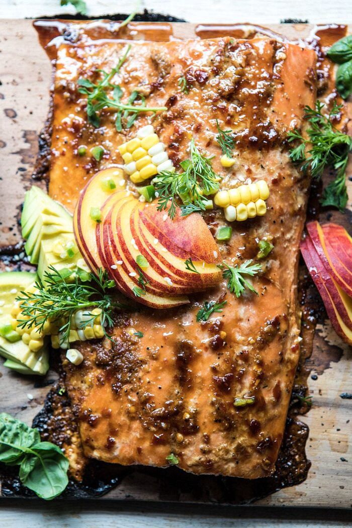 overhead close up photo of Honey Ginger Cedar Plank Grilled Salmon with Avocado Salsa 