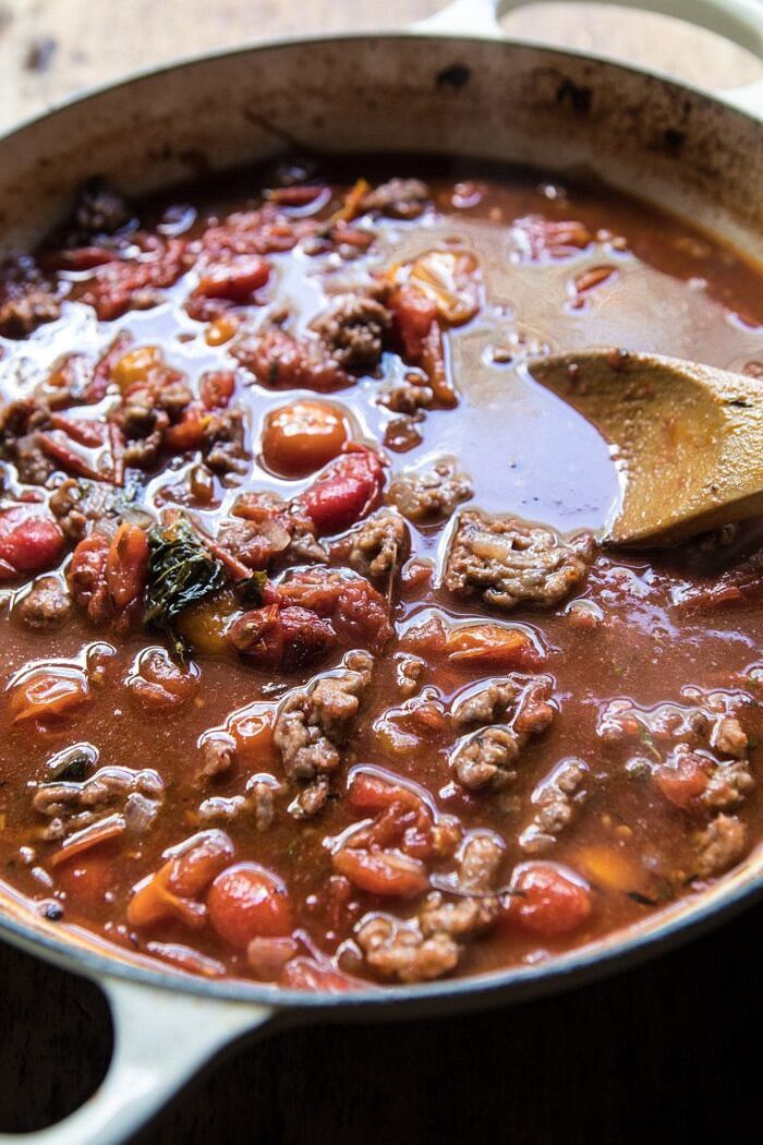One Pan Zucchini and 3 Cheese Lasagna | halfbakedharvest.com #healthy #summerrecipes #onepan #pasta side angle photo of tomato sauce in skillet