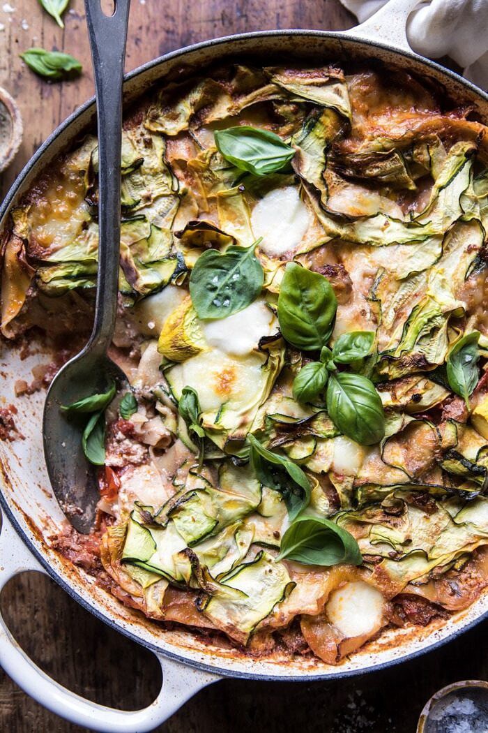 One Pan Zucchini and 3 Cheese Lasagna | halfbakedharvest.com #healthy #summerrecipes #onepan #pasta overhead photo of One Pan Zucchini and 3 Cheese Lasagna with spoon in dish
