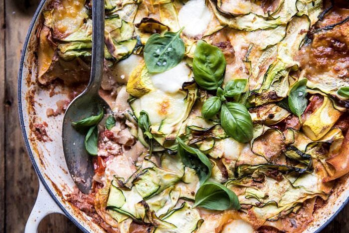 One Pan Zucchini and 3 Cheese Lasagna | halfbakedharvest.com #healthy #summerrecipes #onepan #pasta horizontal photo One Pan Zucchini and 3 Cheese Lasagna with spoon in pan