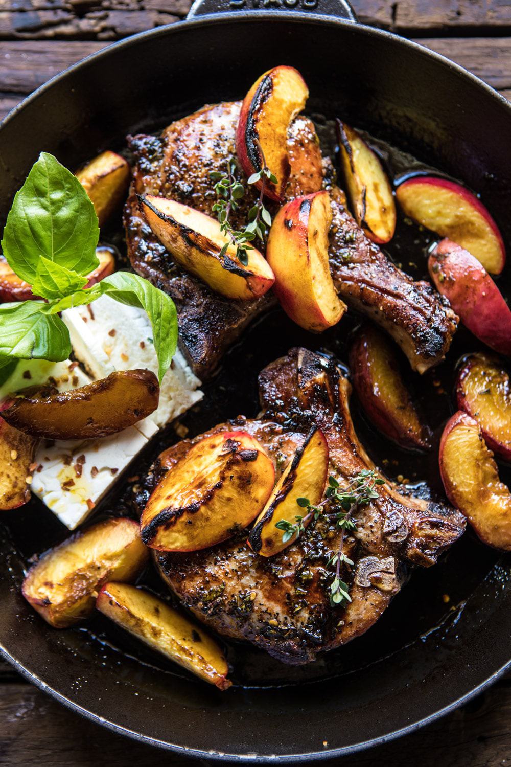 Skillet Balsamic Peach Pork Chops with Feta and Basil | halfbakedharvest.com #peaches #porkchops #easydinner #skilletrecipe