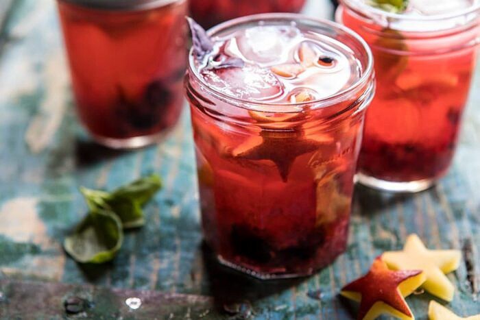 Smashed Berry Rose Spritz | halfbakedharvest.com #cocktails #4thofjulyrecipe #summerrecipes #easy
