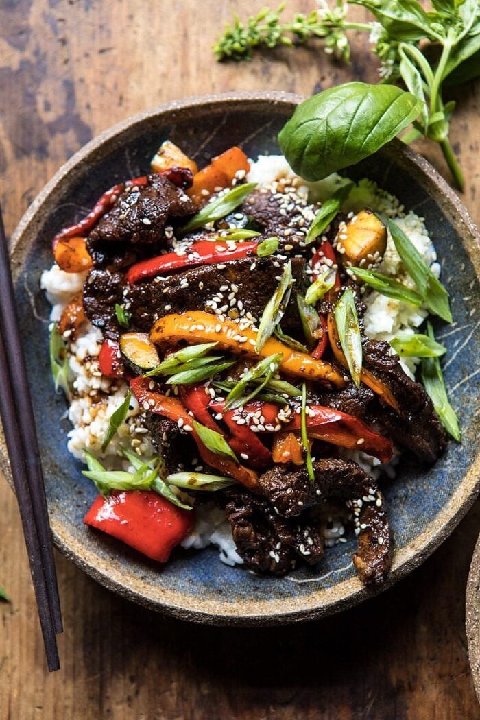 30 Minute Korean Beef and Peppers with Sesame Rice | halfbakedharvest.com #quick #easy #familydinner #korean #steak overhead close up photo of 30 Minute Korean Beef and Peppers with Sesame Rice