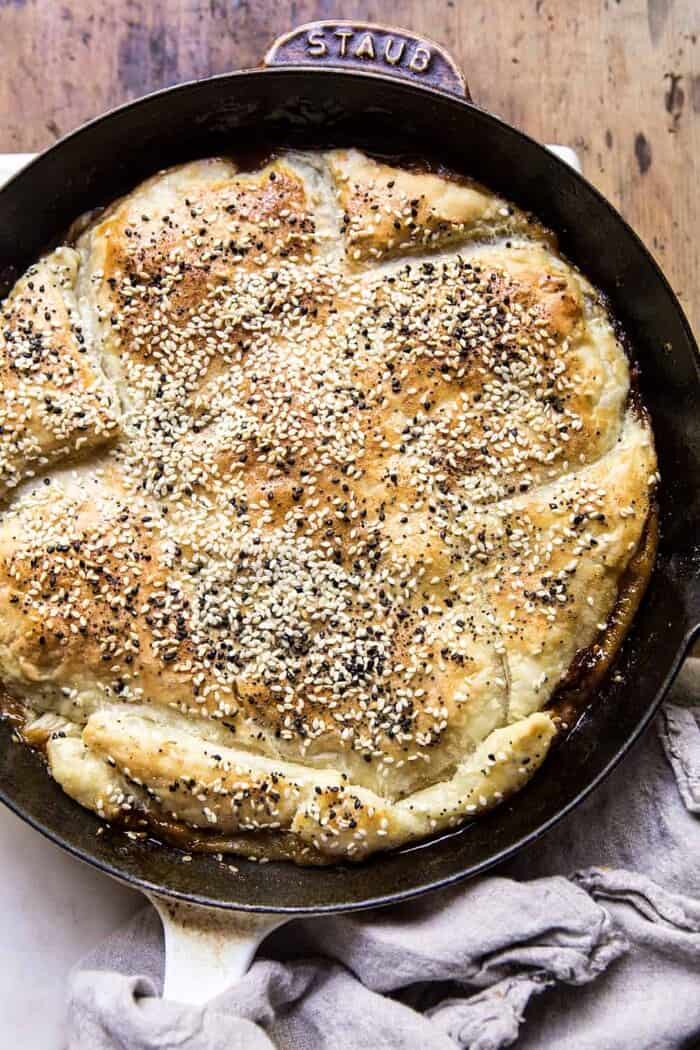 overhead photo of Caramelized Corn and Tomato Tarte Tatin in skillet 