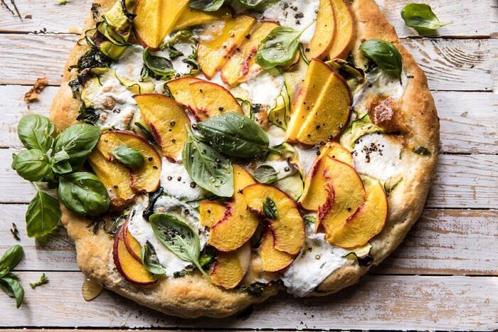 Pesto Zucchini and Peach Pizza with Burrata | halfbakedharvest.com #peach #pizza #summer #easyrecipes horizontal photo of Pesto Zucchini and Peach Pizza with Burrata