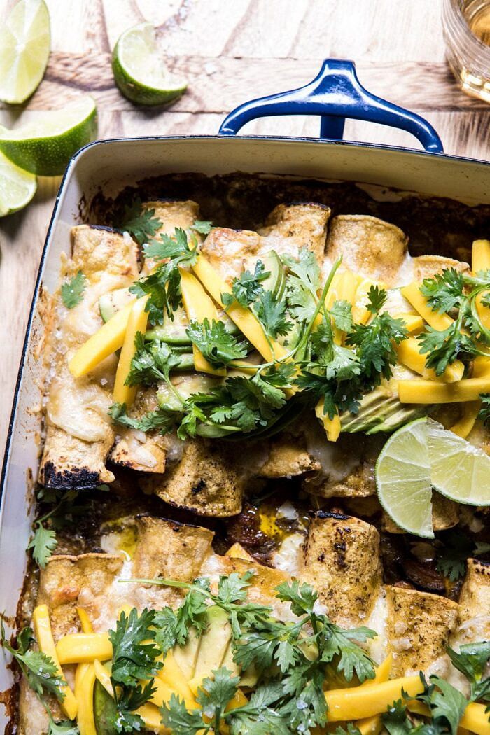 Salsa Verde Chicken and Zucchini Enchiladas with Mango | halfbakedharvest.com #mexican #enchiladas #zucchini #summerrecipes #easy side angled photo of Salsa Verde Chicken and Zucchini Enchiladas with Mango | halfbakedharvest.com #mexican #enchiladas #zucchini #summerrecipes #easy