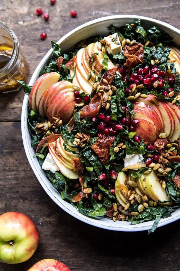 side photo of Fall Harvest Honeycrisp Apple and Kale Salad with apples and vinaigrette in photo 