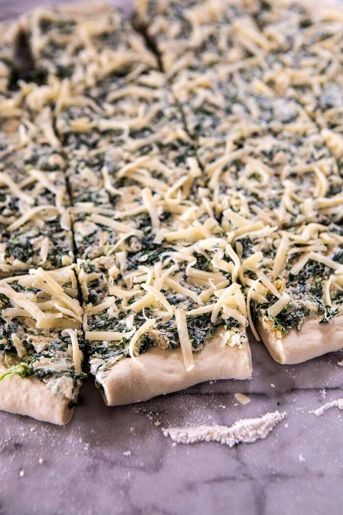 Herbed Spinach and Artichoke Pull Apart Pretzel Bread | halfbakedharvest.com #bread #appetizer #gamedayrecipes #easyrecipes Herbed Spinach and Artichoke Pull Apart Pretzel Bread dough before being stacked