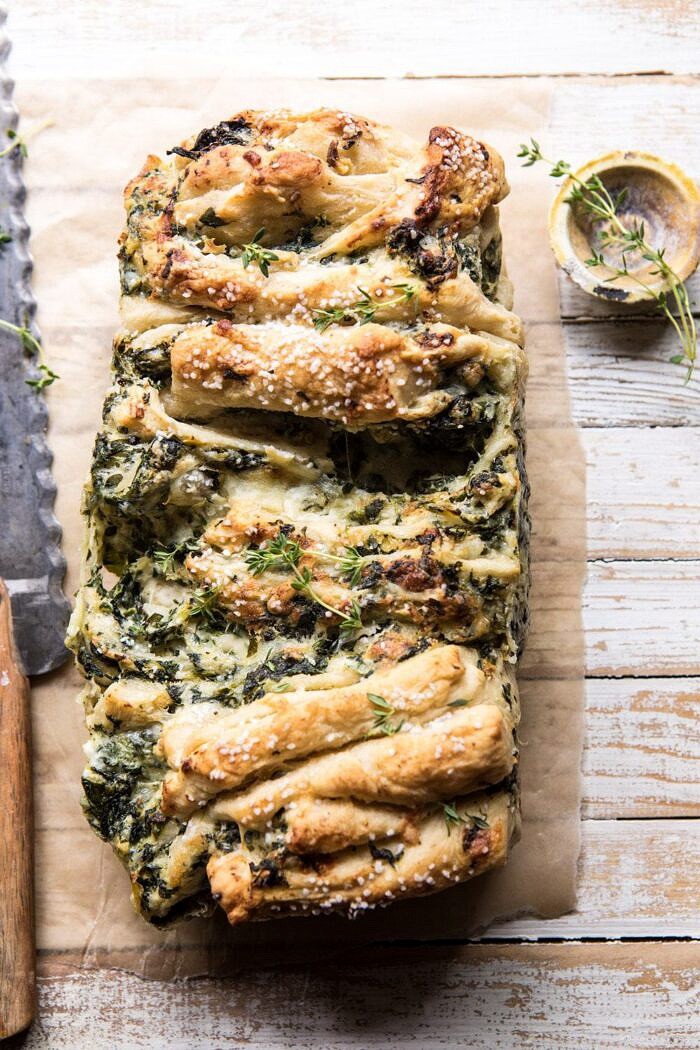 Herbed Spinach and Artichoke Pull Apart Pretzel Bread | halfbakedharvest.com #bread #appetizer #gamedayrecipes #easyrecipes overhead photo of Herbed Spinach and Artichoke Pull Apart Pretzel Bread