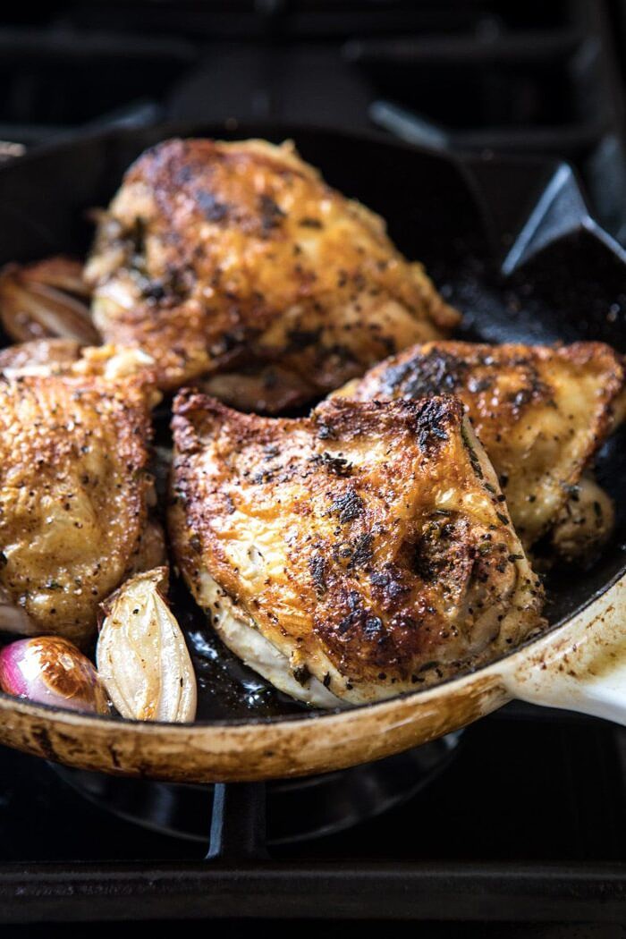 One Pot Chicken and Sage Dumplings | halfbakedharvest.com #comfortfood #chicken #soup #fallrecipes #easyrecipes side angle photo of chicken in skillet