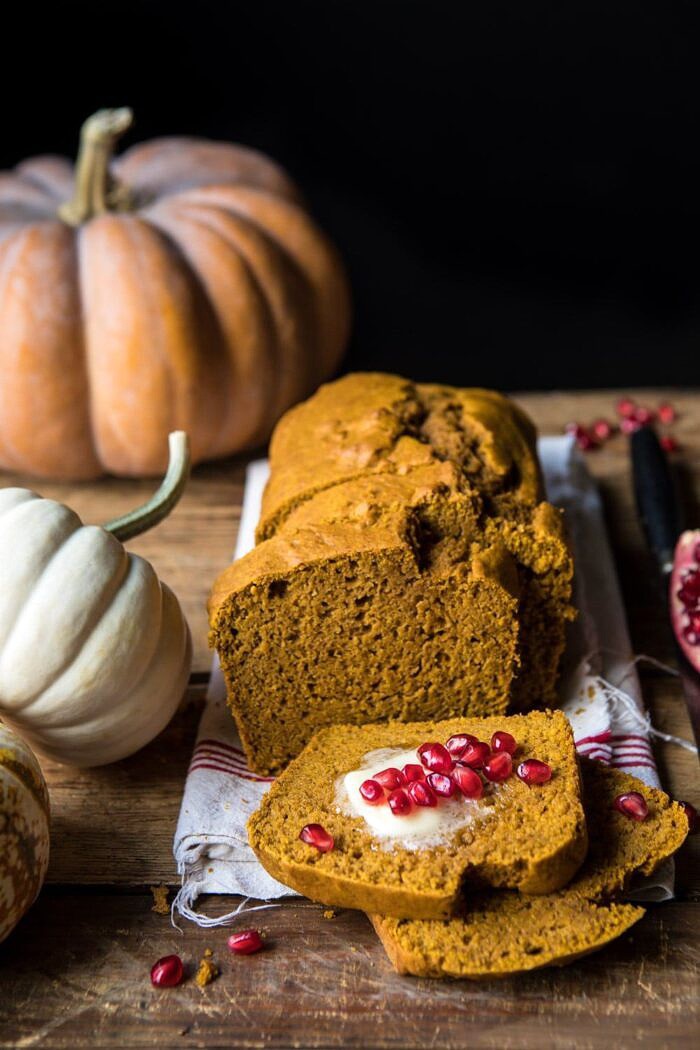 Healthy Pumpkin Ginger Bread | halfbakedharvest.com #healthy #pumpkin #bread #fall #thanksgiving #easyrecipes side angle photo of Healthy Pumpkin Ginger Bread with pumpkins in photo