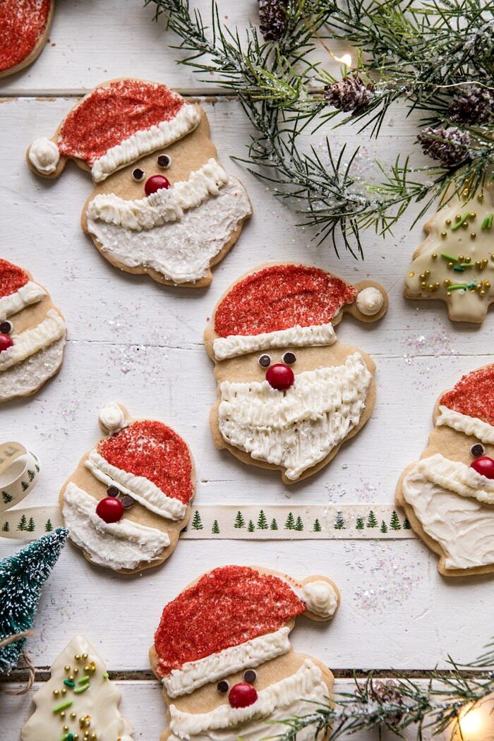 Chai Spiced Santa Cookies with White Chocolate Frosting | halfbakedharvest.com #sugarcookies #christmas #holiday #chai #dessert #easyrecipes overhead photo of Chai Spiced Santa Cookies with White Chocolate Frosting