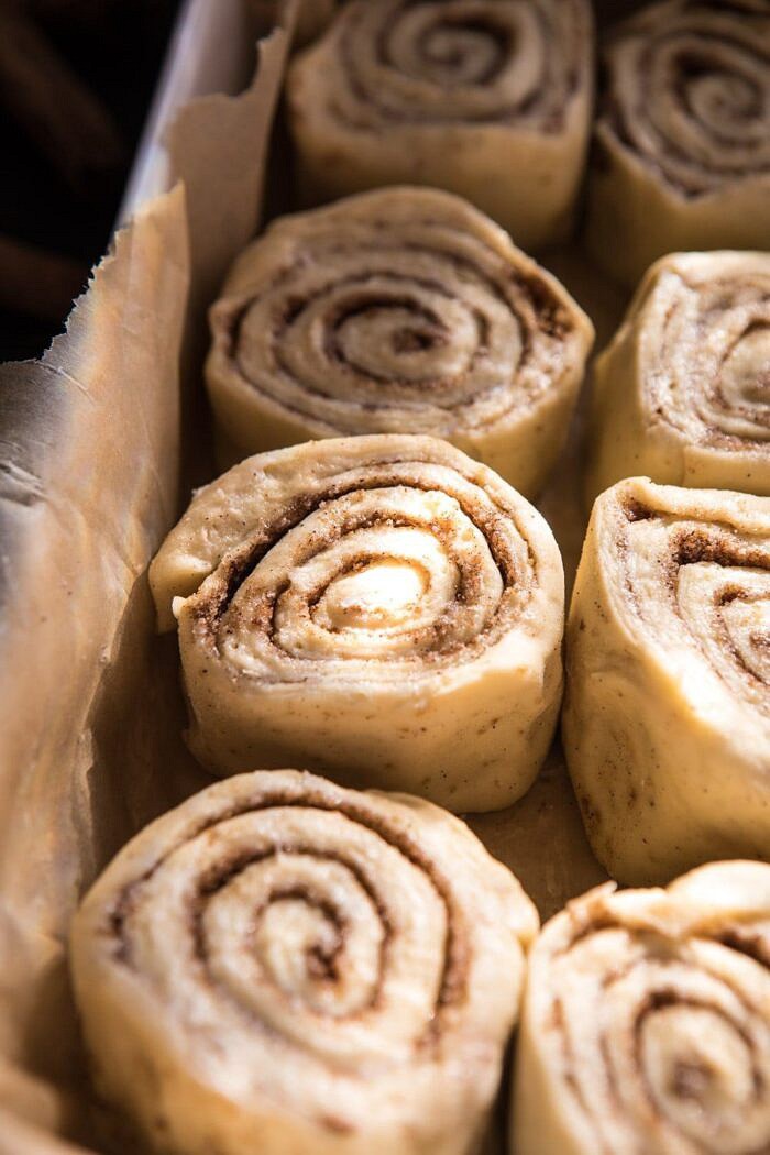 Easiest Overnight Eggnog Brioche Cinnamon Rolls | halfbakedharvest.com #cinnamonrolls #Christmas #easyrecipes #eggnog side angle photo of Easiest Overnight Eggnog Brioche Cinnamon Rolls before baking