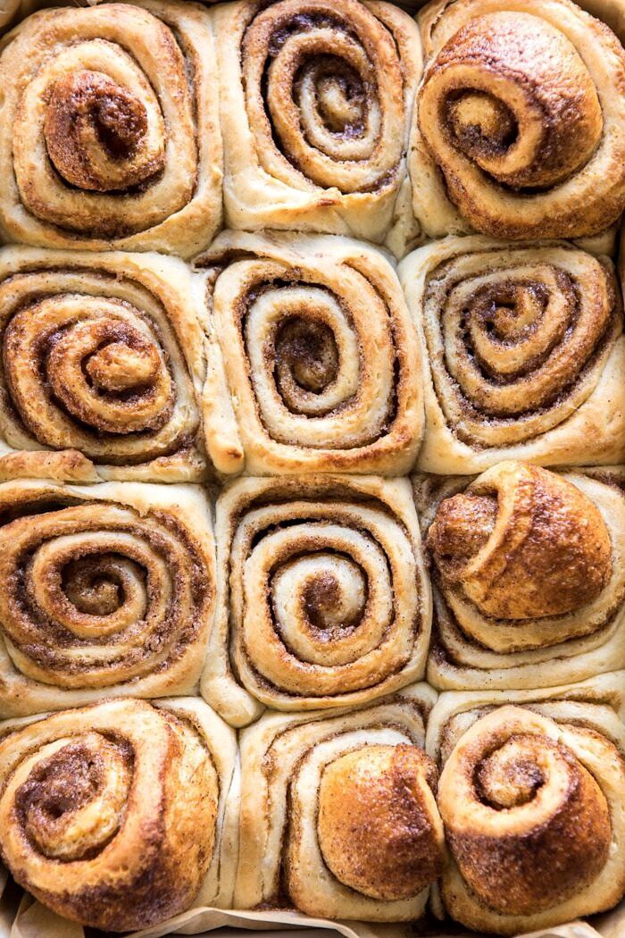 Easiest Overnight Eggnog Brioche Cinnamon Rolls | halfbakedharvest.com #cinnamonrolls #Christmas #easyrecipes #eggnog close up photo of Easiest Overnight Eggnog Brioche Cinnamon Rolls after baking