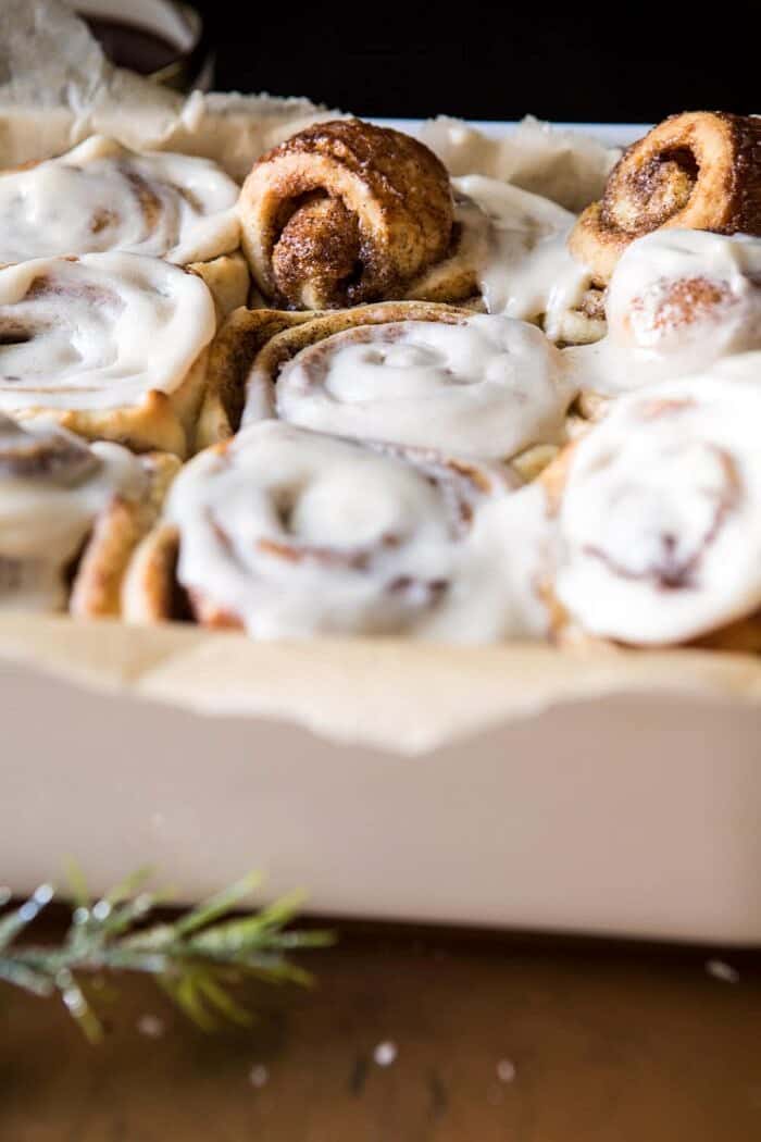 Easiest Overnight Eggnog Brioche Cinnamon Rolls | halfbakedharvest.com #cinnamonrolls #Christmas #easyrecipes #eggnog side angle photo of Easiest Overnight Eggnog Brioche Cinnamon Rolls