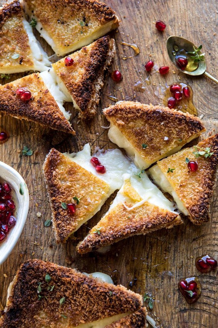 overhead photo of Fried Mozzarella Sandwiches with Pomegranate Honey cut into triangles 