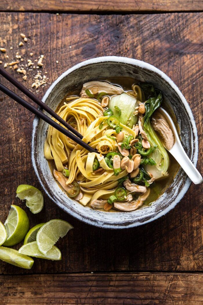 Ginger Peanut Chicken Noodle Soup | halfbakedharvest.com #soup #healthyrecipe #chickensoup #easyrecipes overhead photo of Ginger Peanut Chicken Noodle Soup with chopsticks in bowl