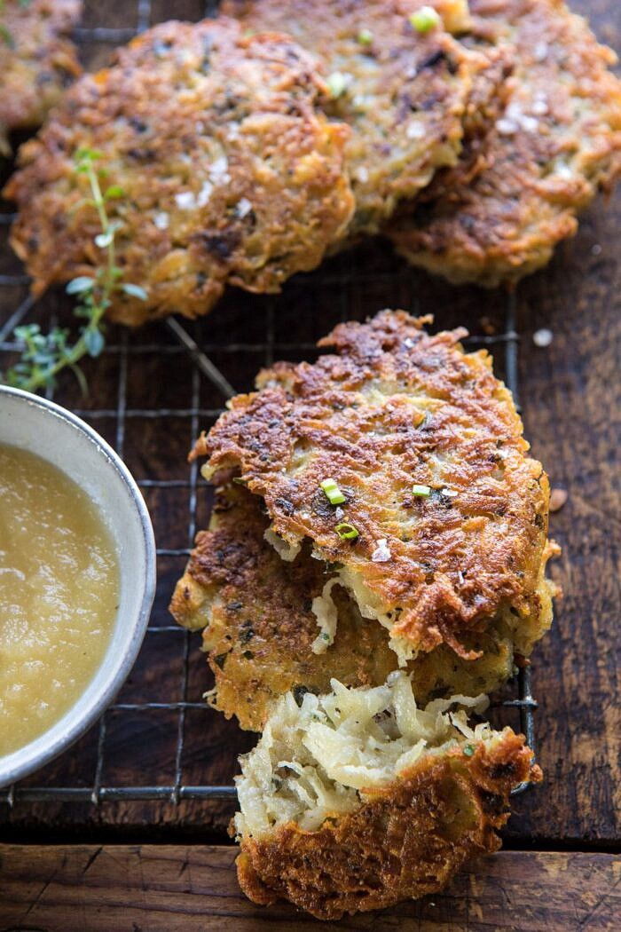 Herbed Cheddar Latkes | halfbakedharvest.com #potatoes #latkes #cheese #holiday #christmas #Hanukkah side angle photo of Herbed Cheddar Latkes